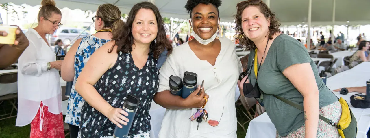 Three staff members at an employee picnic.