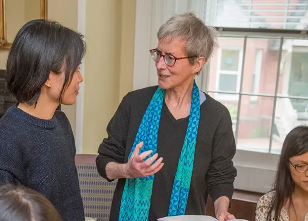 Professor speaking to two students